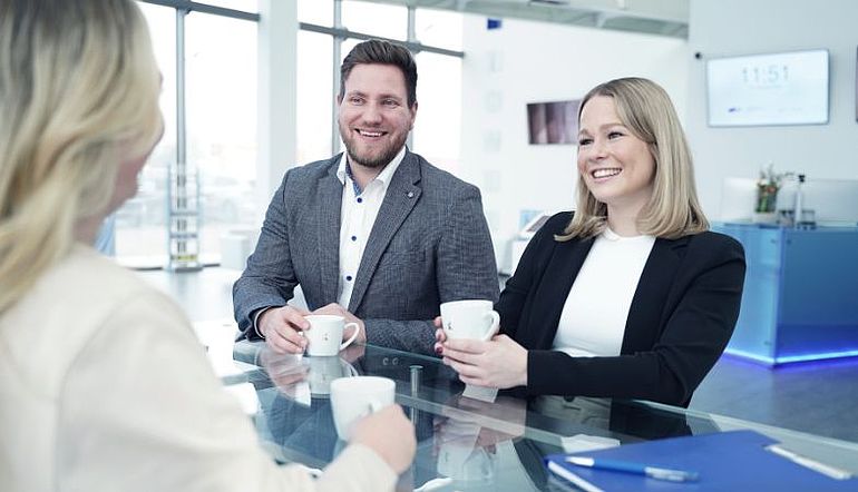 A man and a woman discussing a thesis
